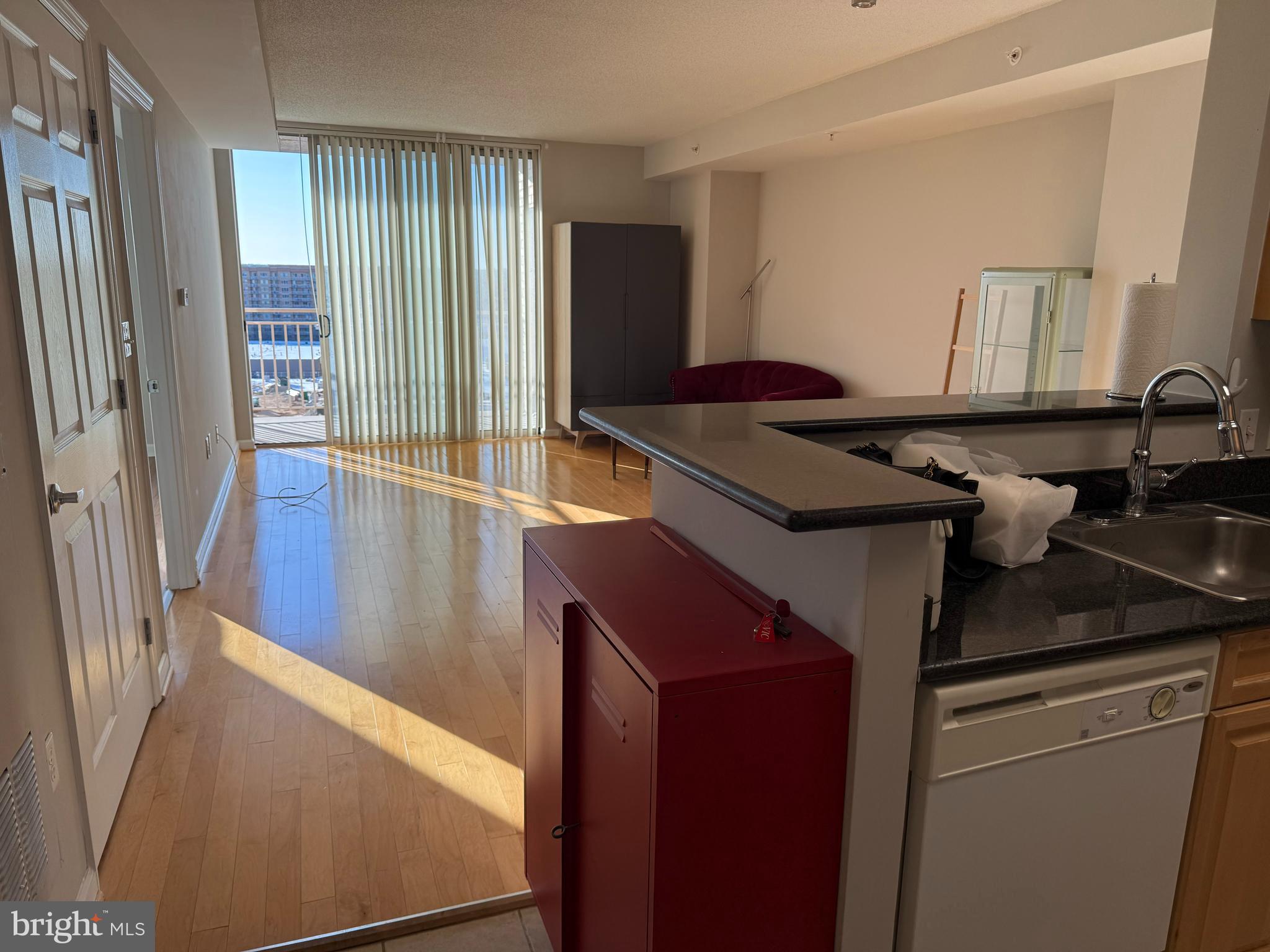 2726 Gallows Road, Unit 915 Vienna, VA 22180 - Photo 11 of 32 a kitchen with a refrigerator and a sink