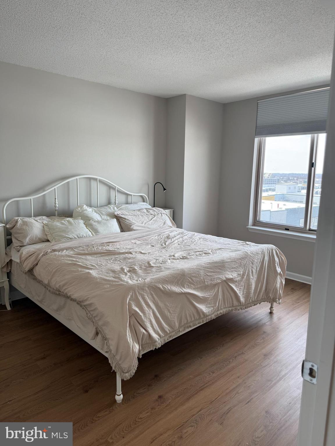 2726 Gallows Road, Unit 915 Vienna, VA 22180 - Photo 14 of 32 a large bed sitting in a bedroom next to a window