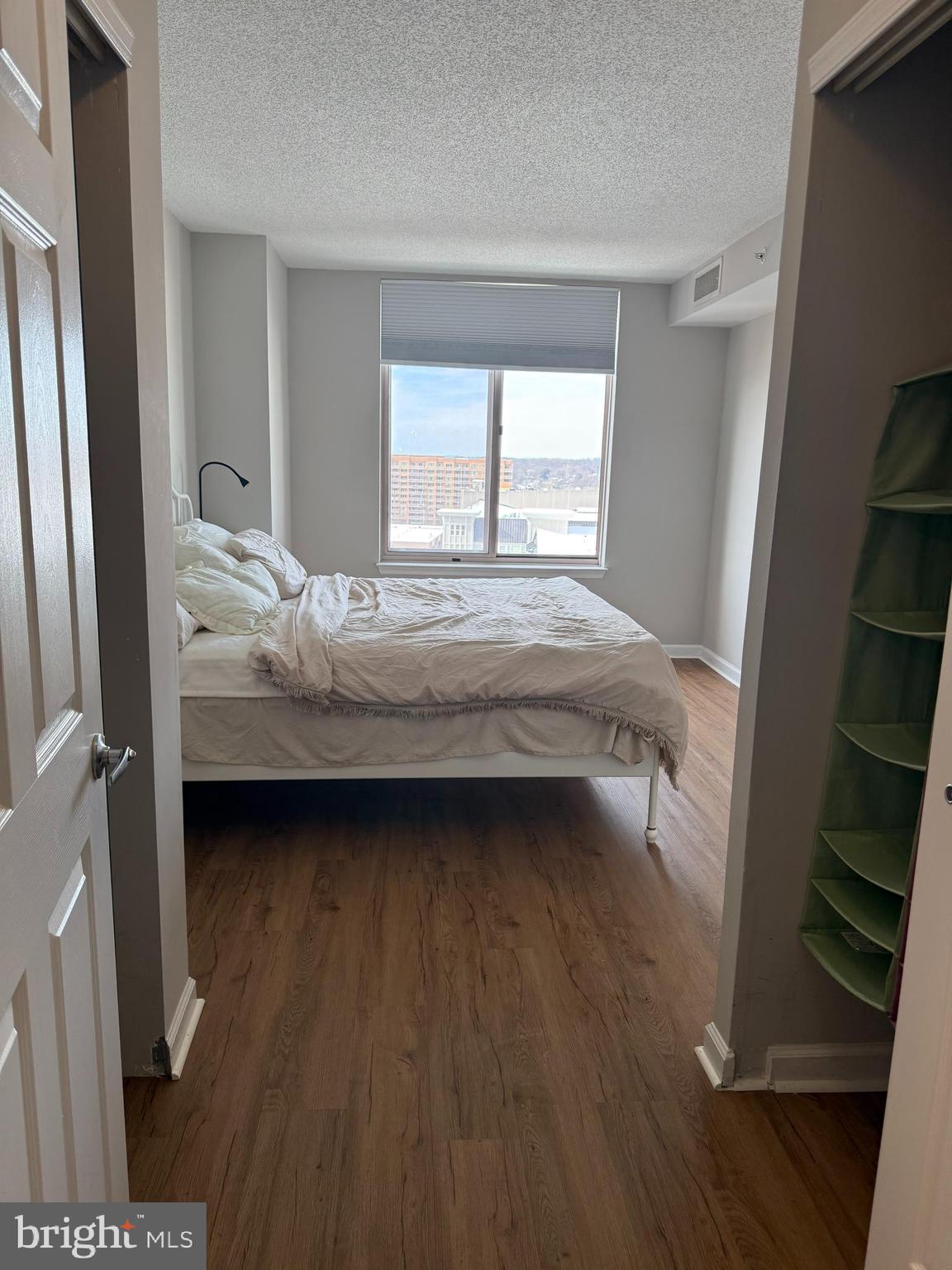 2726 Gallows Road, Unit 915 Vienna, VA 22180 - Photo 15 of 32 a bedroom with a bed and a window