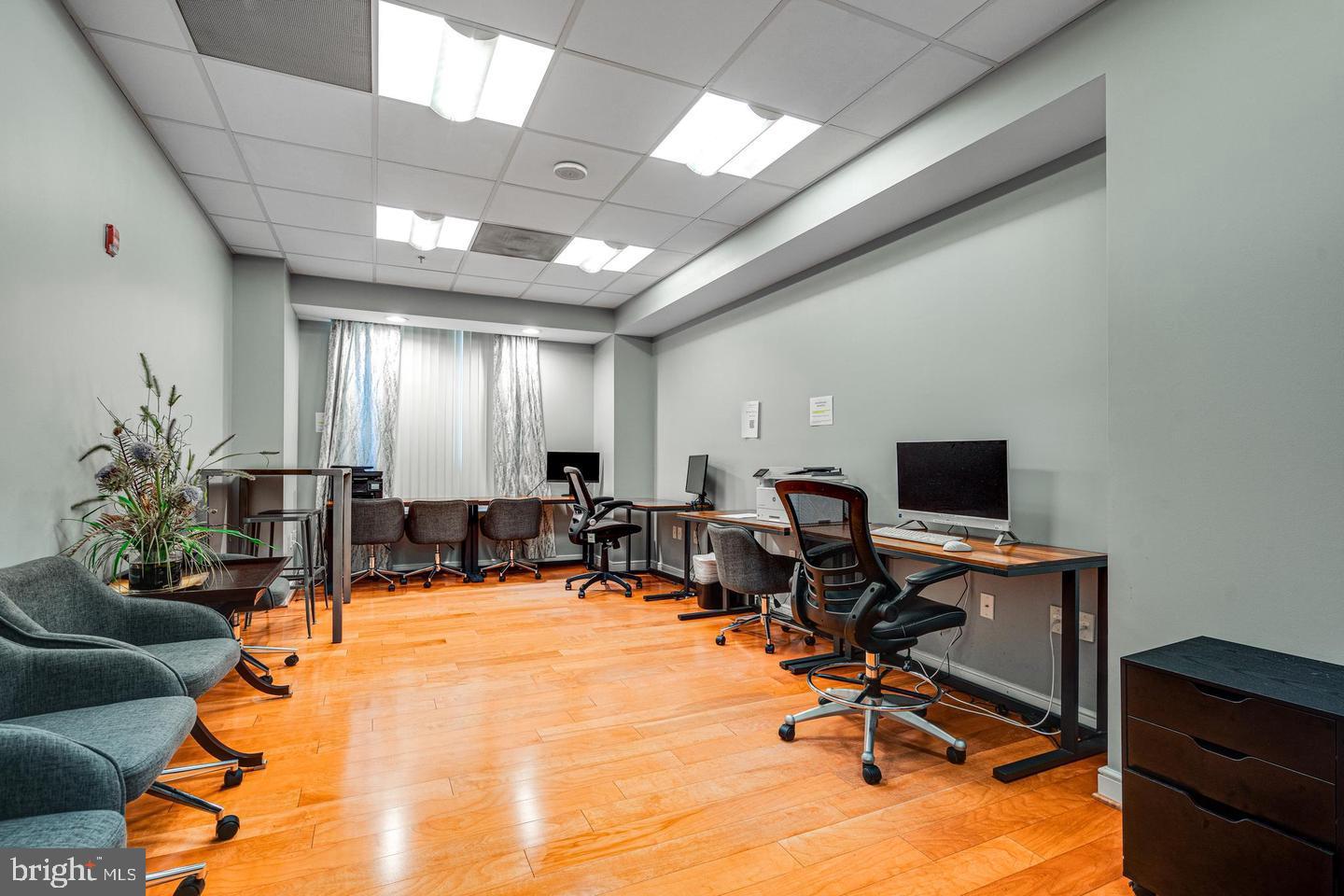 2726 Gallows Road, Unit 915 Vienna, VA 22180 - Photo 24 of 32 a view of a livingroom with workspace and a window