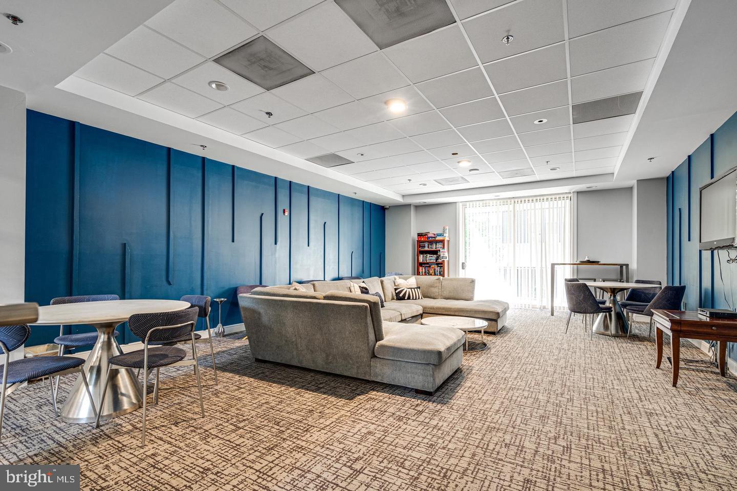 2726 Gallows Road, Unit 915 Vienna, VA 22180 - Photo 25 of 32 a living room with furniture and a large window