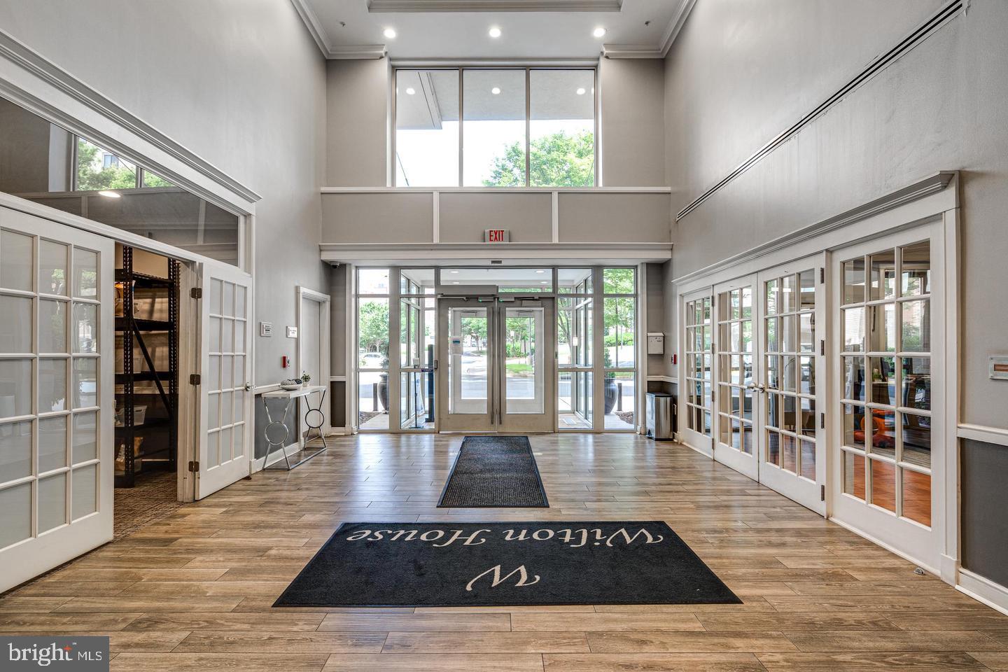 2726 Gallows Road, Unit 915 Vienna, VA 22180 - Photo 28 of 32 a view of a livingroom with furniture wooden floor and windows