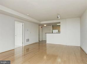 2726 Gallows Road, Unit 915 Vienna, VA 22180 - Photo 6 of 32 wooden floor in an empty room