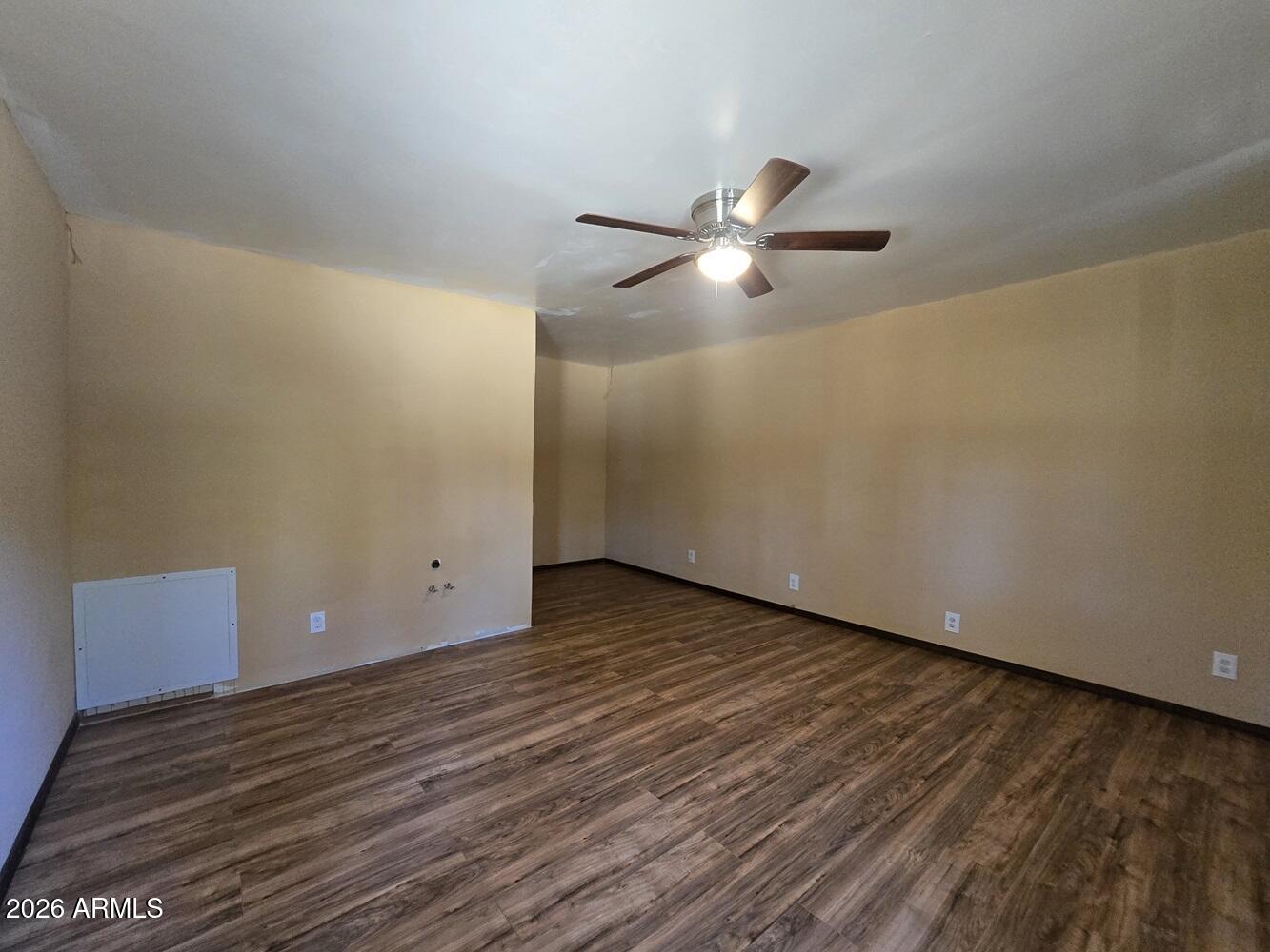 118 East Frontier Street Payson, AZ 85541 - Photo 13 of 22 a view of an empty room and wooden floor