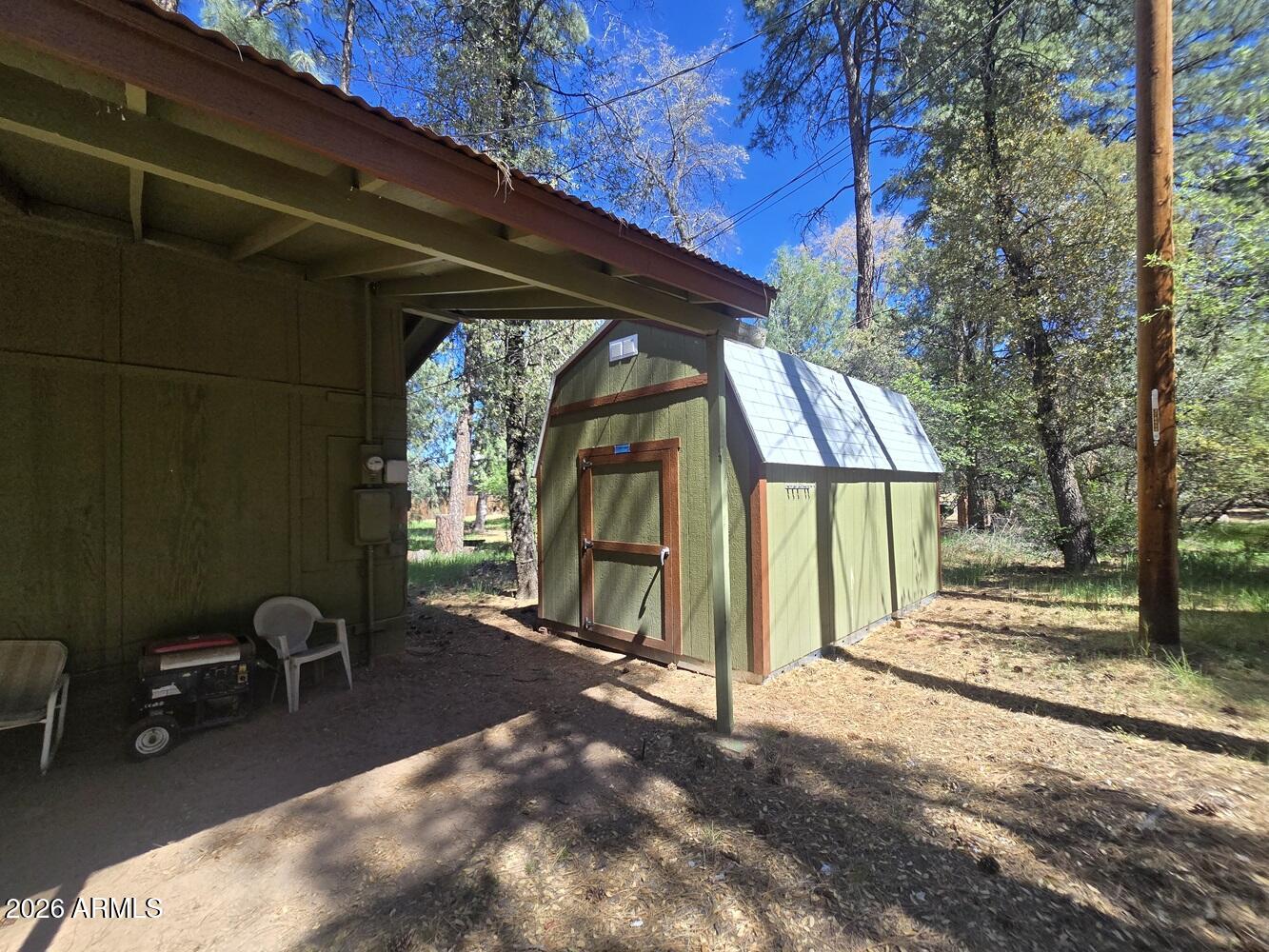 118 East Frontier Street Payson, AZ 85541 - Photo 17 of 22 a view of backyard with a grill and a chair