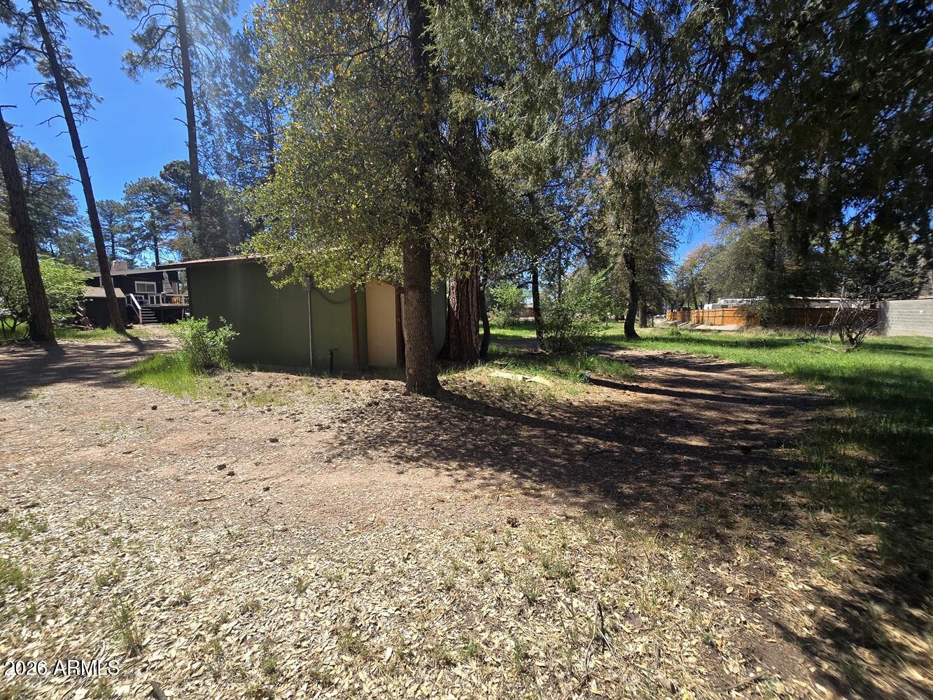 118 East Frontier Street Payson, AZ 85541 - Photo 18 of 22 a view of a backyard with large trees
