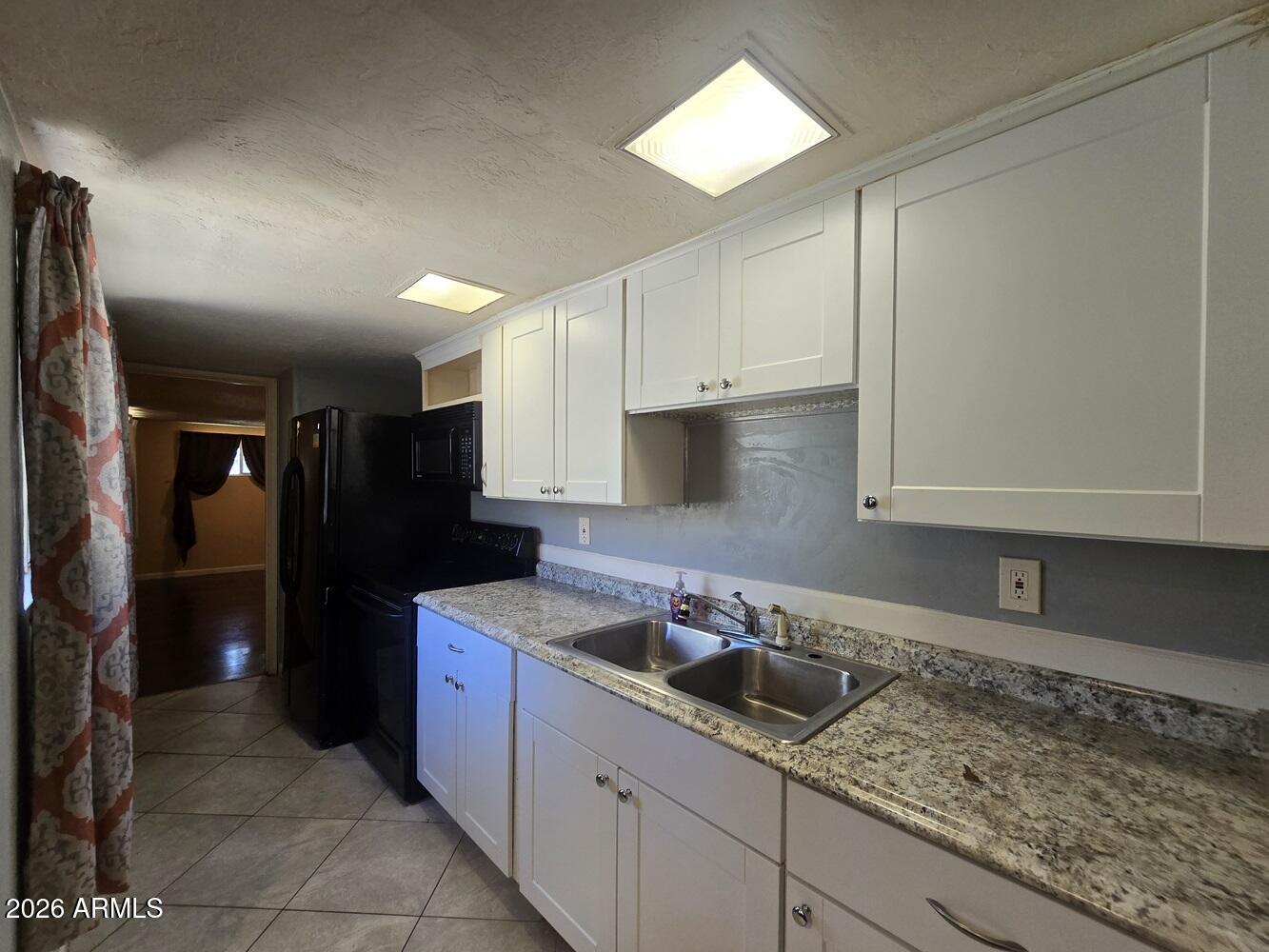 118 East Frontier Street Payson, AZ 85541 - Photo 5 of 22 a kitchen with a sink and cabinets