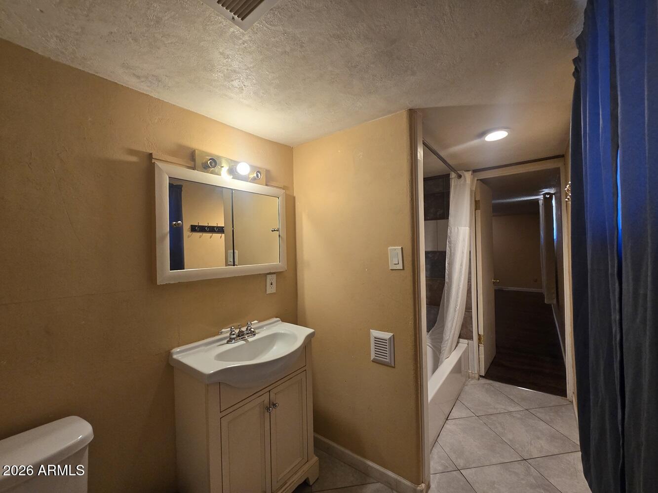 118 East Frontier Street Payson, AZ 85541 - Photo 9 of 22 a bathroom with a sink and mirror