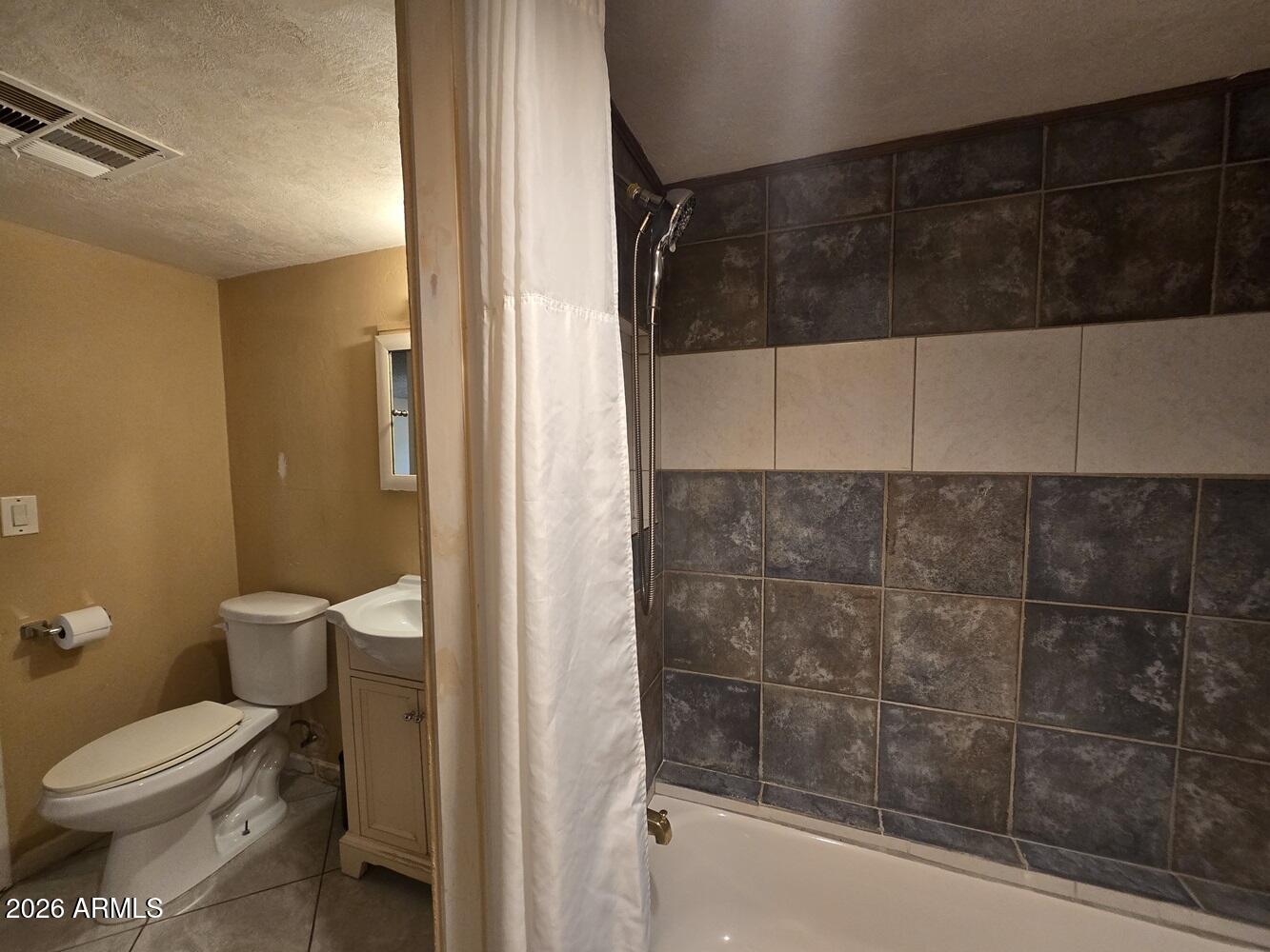 118 East Frontier Street Payson, AZ 85541 - Photo 10 of 22 a bathroom with a toilet and a shower