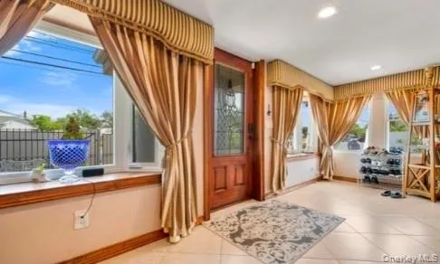 a view of front door and bedroom