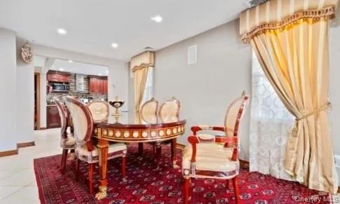 a dining room with furniture and window