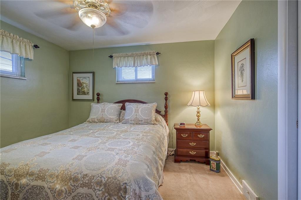 577 Hillcrest Avenue McKees Rocks, PA 15136 - Photo 14 of 23 a bedroom with a bed and a chandelier