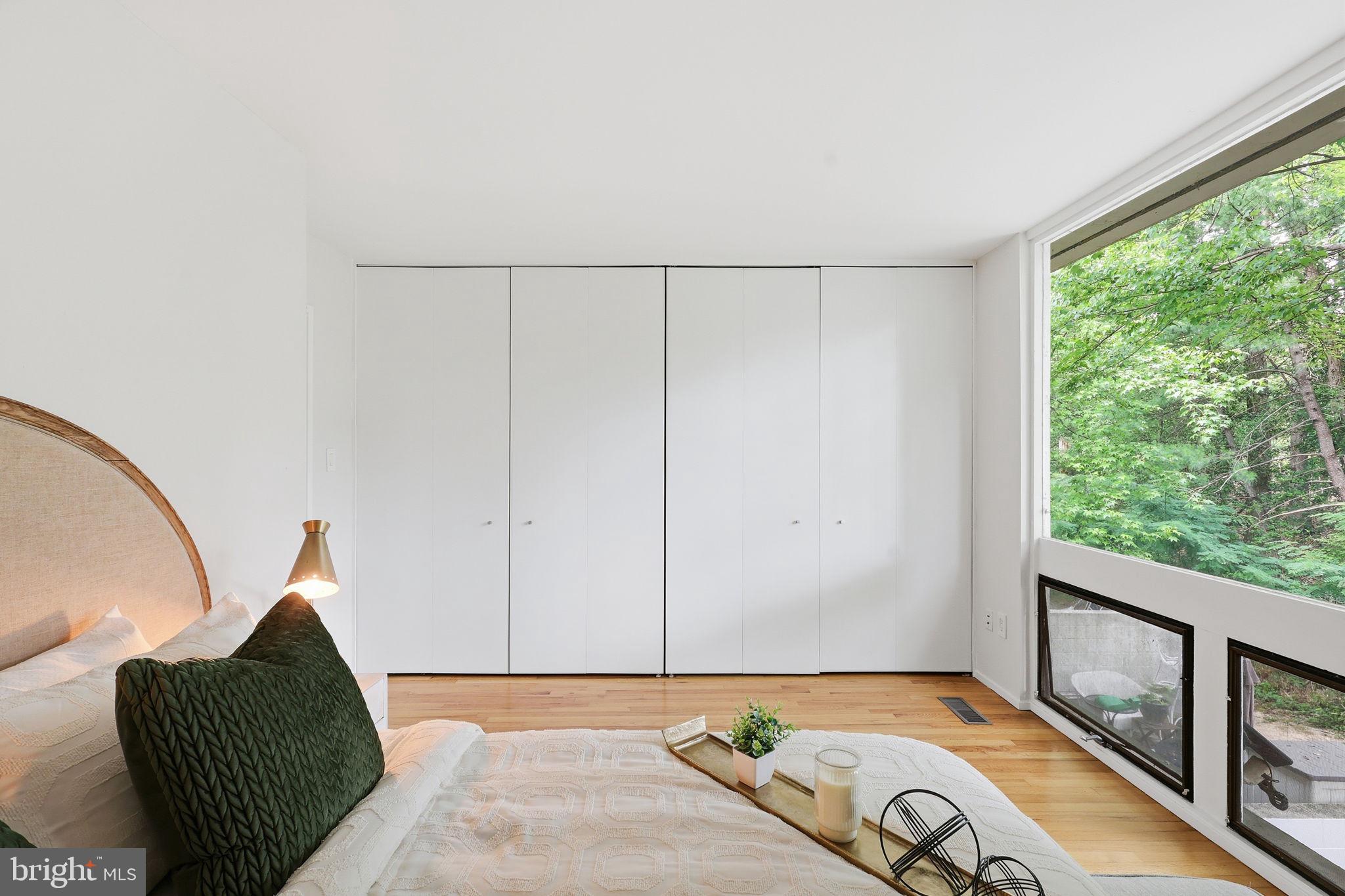 11510 Maple Ridge Road Reston, VA 20190 - Photo 22 of 43 a view of a bedroom with window and couch