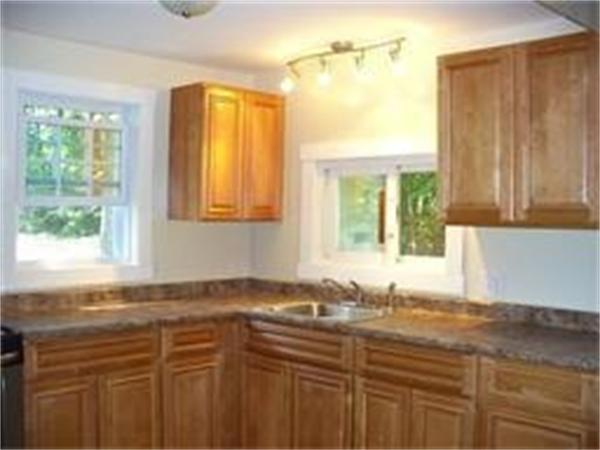88 Pequot Point Road Westfield, MA 01085 - Photo 3 of 5 a bathroom with a granite countertop sink and a window