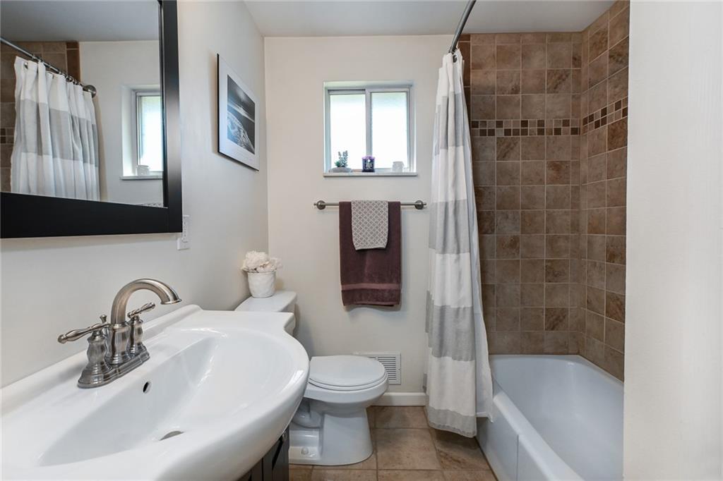 171 Mary Reed Road Baden, PA 15005 - Photo 12 of 25 a bathroom with a sink toilet and shower
