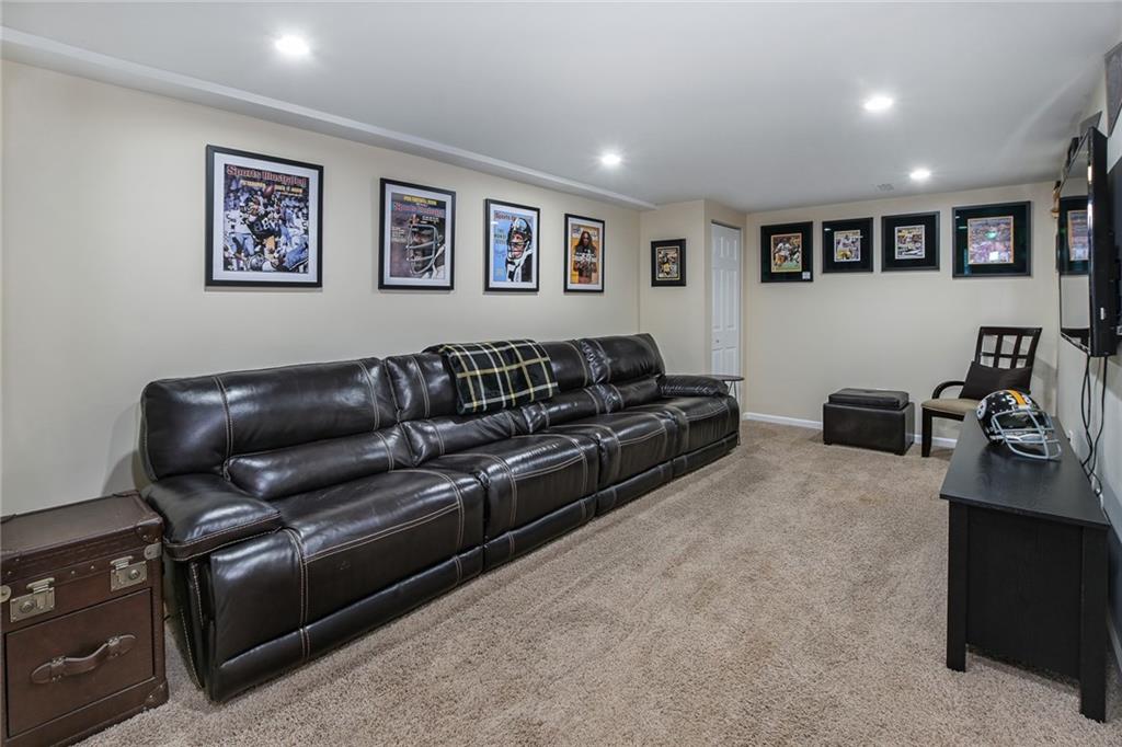 171 Mary Reed Road Baden, PA 15005 - Photo 13 of 25 a living room with furniture and a flat screen tv