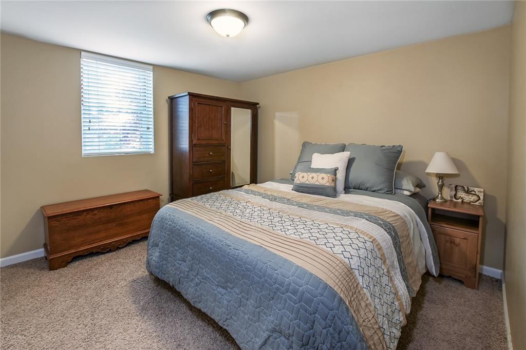 171 Mary Reed Road Baden, PA 15005 - Photo 14 of 25 a bedroom with a bed and a window