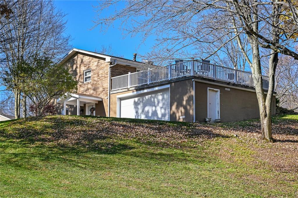171 Mary Reed Road Baden, PA 15005 - Photo 19 of 25 a house with trees in the background
