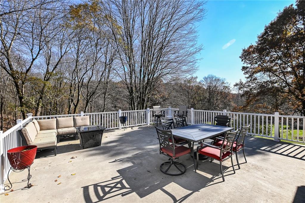 171 Mary Reed Road Baden, PA 15005 - Photo 22 of 25 a view of backyard with furniture and trees