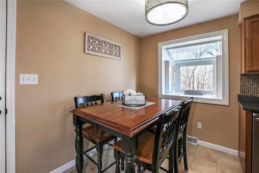 171 Mary Reed Road Baden, PA 15005 - Photo 5 of 25 a view of a dining room that has a table and chairs in it