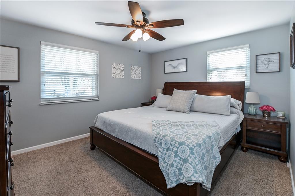 171 Mary Reed Road Baden, PA 15005 - Photo 9 of 25 a bedroom with bed and a chandelier