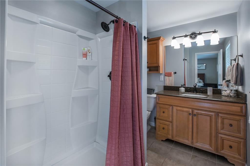 171 Mary Reed Road Baden, PA 15005 - Photo 10 of 25 a bathroom with a sink and a mirror