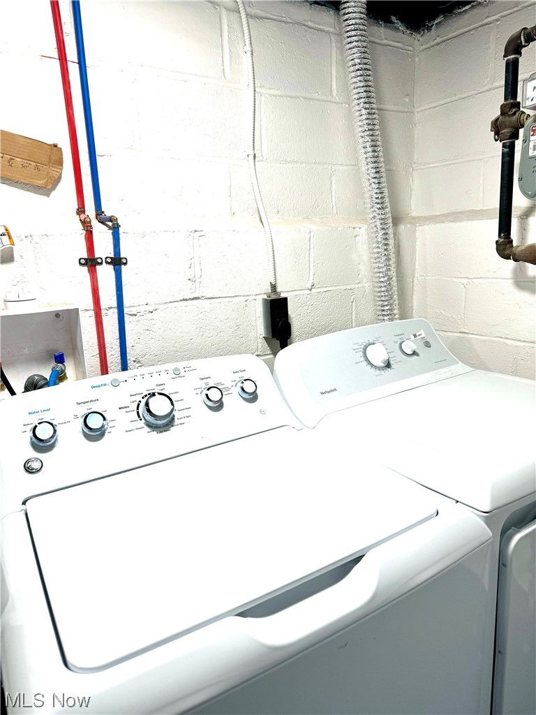 21116 Watson Road Maple Heights, OH 44137 - Photo 18 of 25 Laundry room with hookup for a washing machine and washing machine and dryer