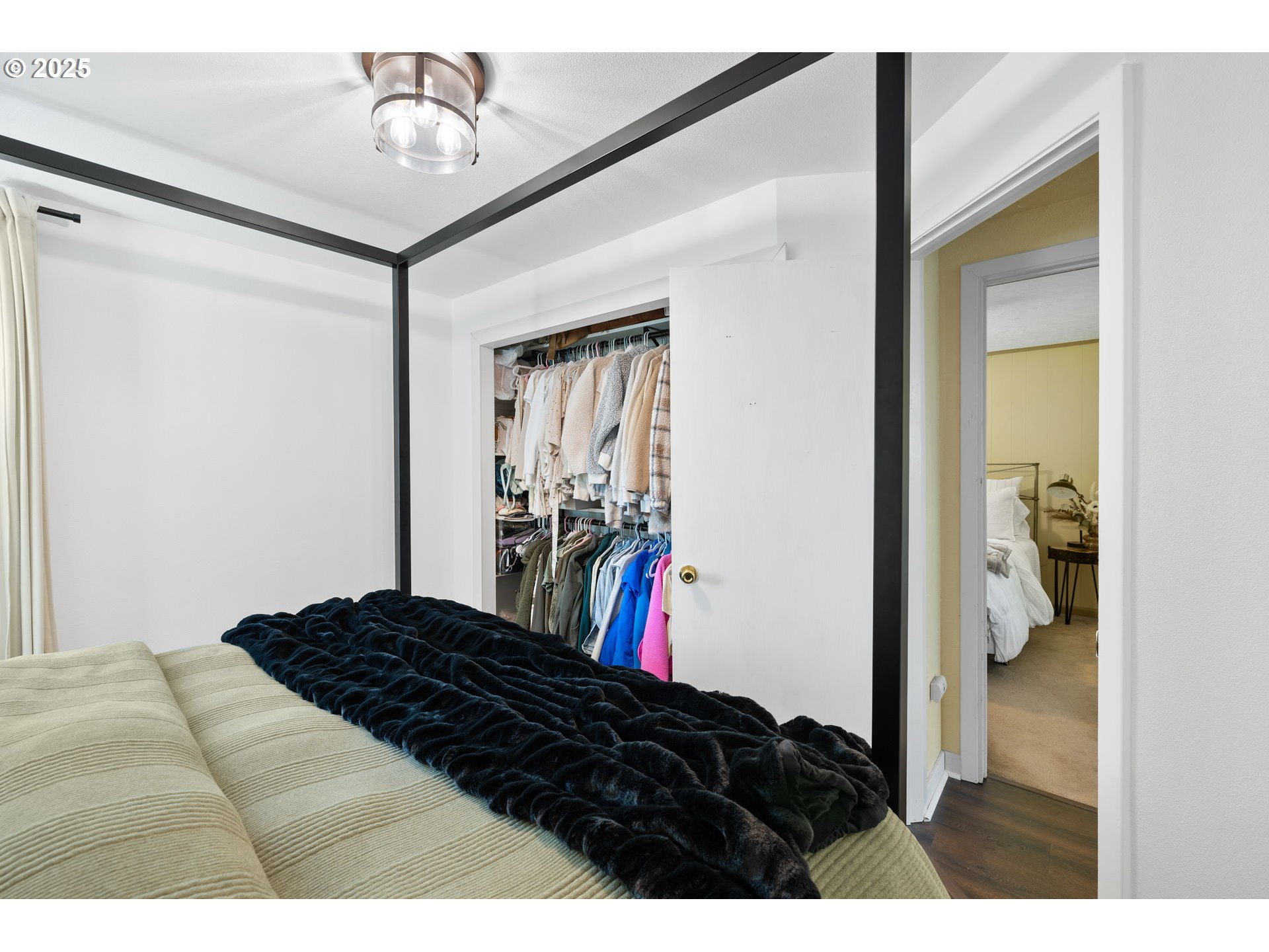 730 Southeast 2nd Avenue Camas, WA 98607 - Photo 11 of 22 a bedroom with a bed and a walk in closet