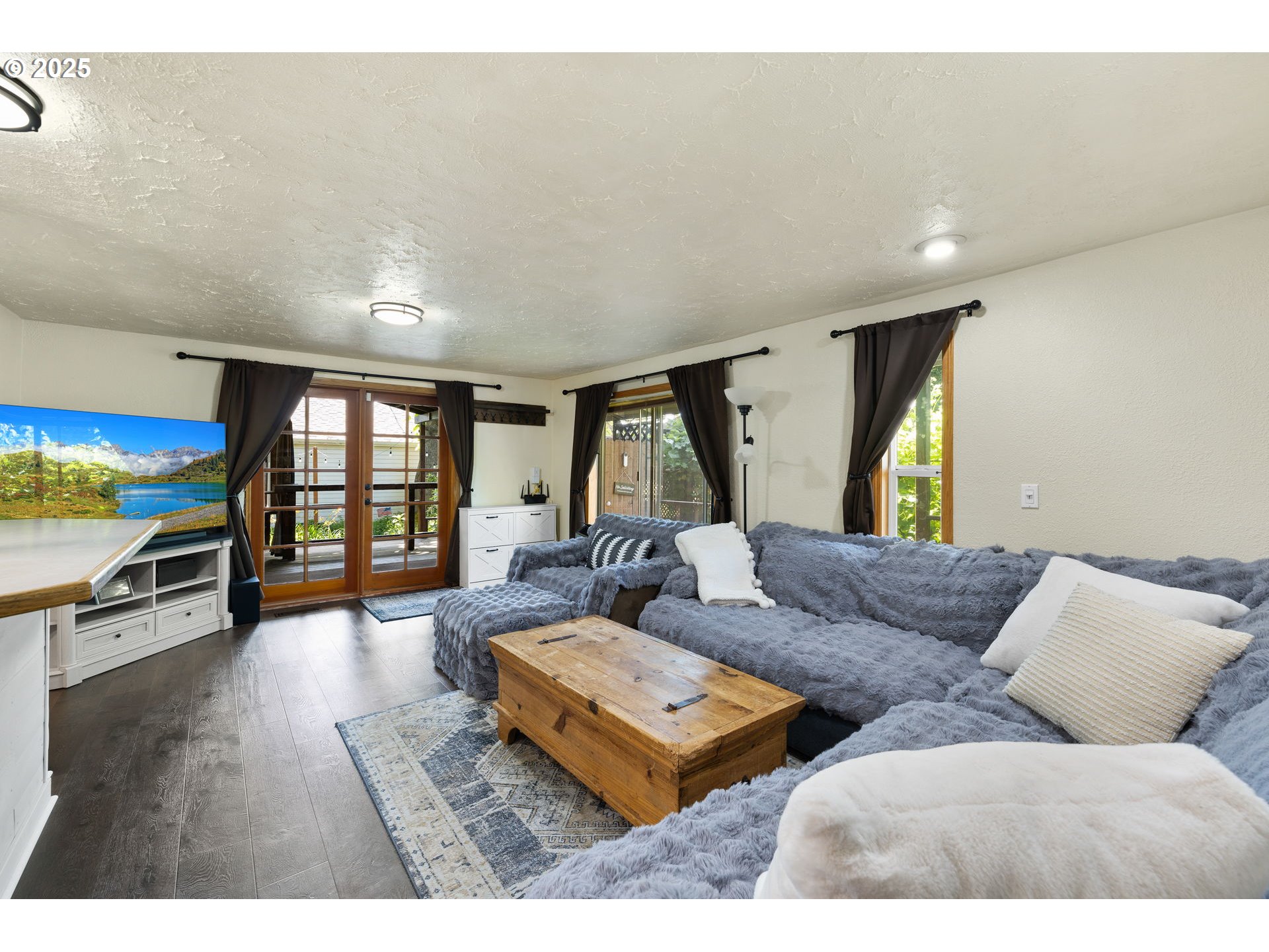 730 Southeast 2nd Avenue Camas, WA 98607 - Photo 2 of 22 a living room with furniture and a wooden floor