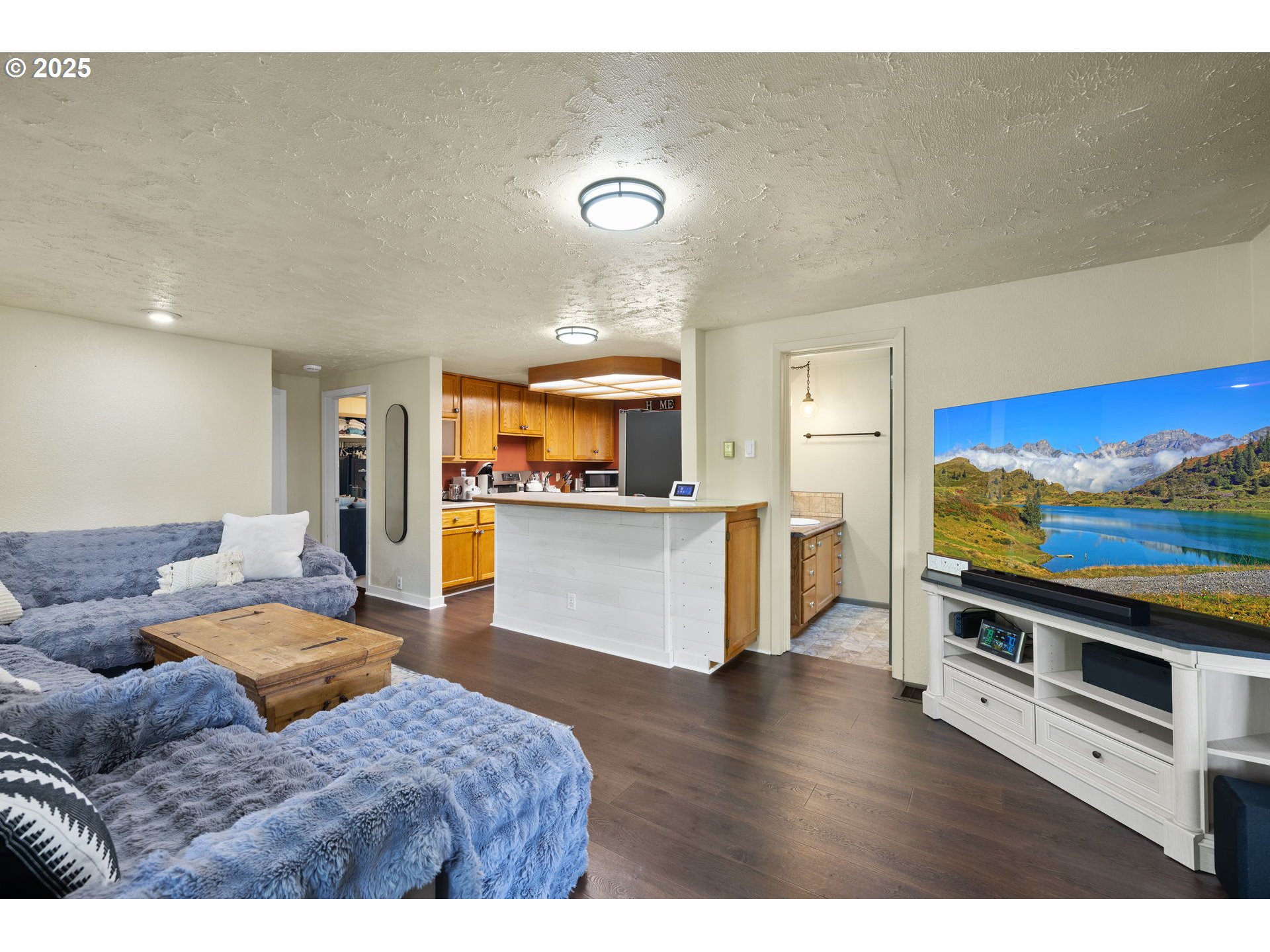730 Southeast 2nd Avenue Camas, WA 98607 - Photo 4 of 22 a living room with furniture and a flat screen tv