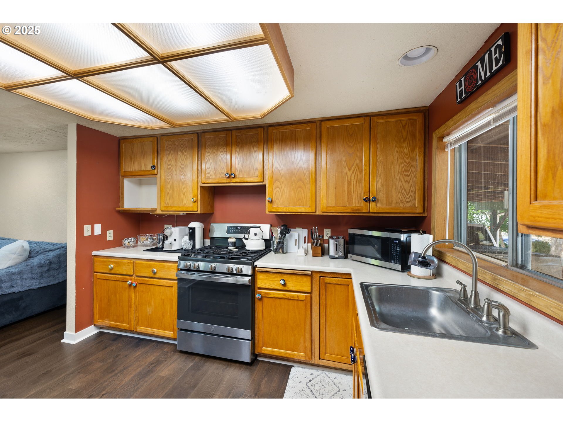 730 Southeast 2nd Avenue Camas, WA 98607 - Photo 6 of 22 a kitchen with stainless steel appliances granite countertop a sink stove and cabinets