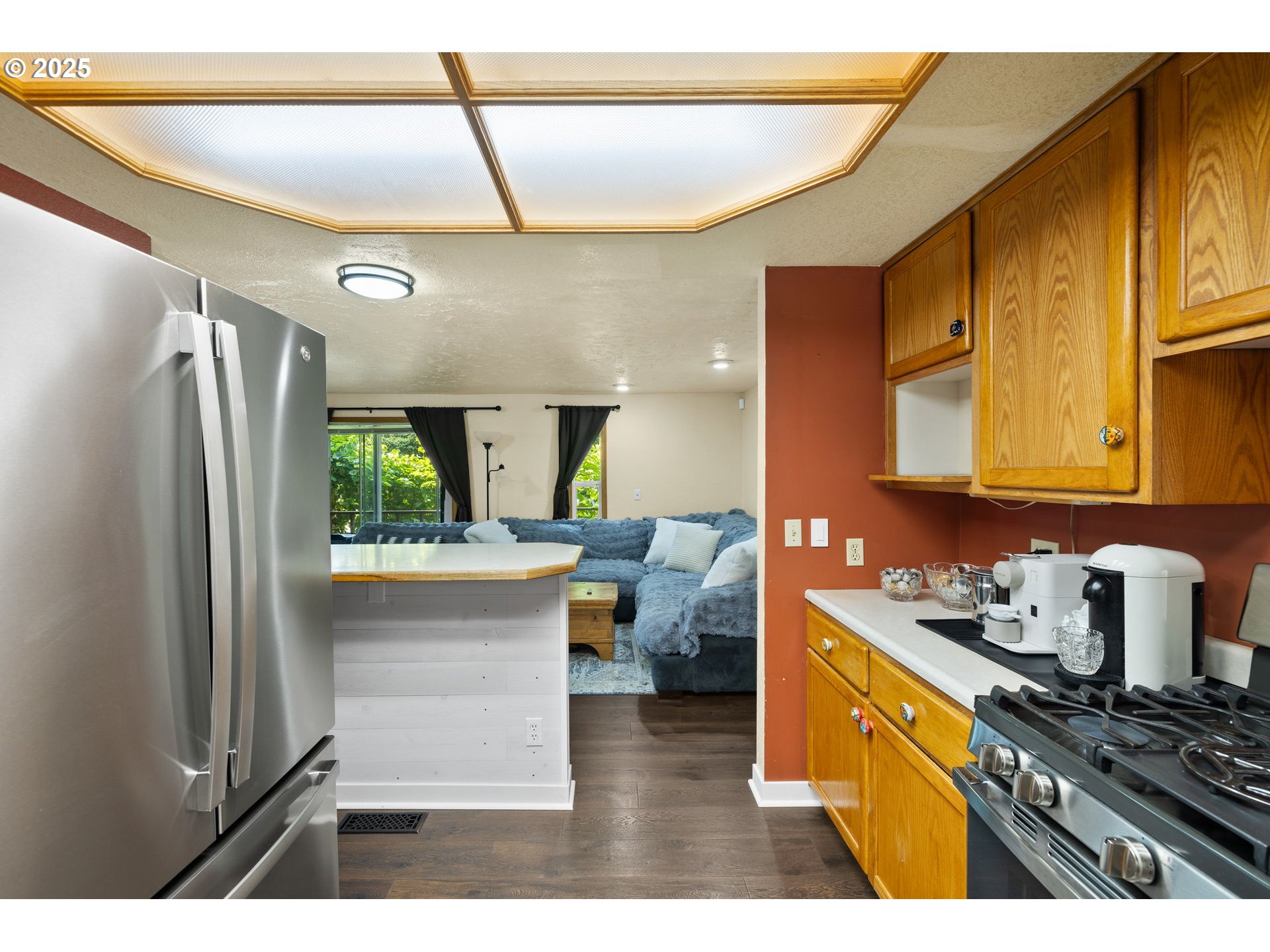 730 Southeast 2nd Avenue Camas, WA 98607 - Photo 7 of 22 a kitchen with refrigerator and cabinets