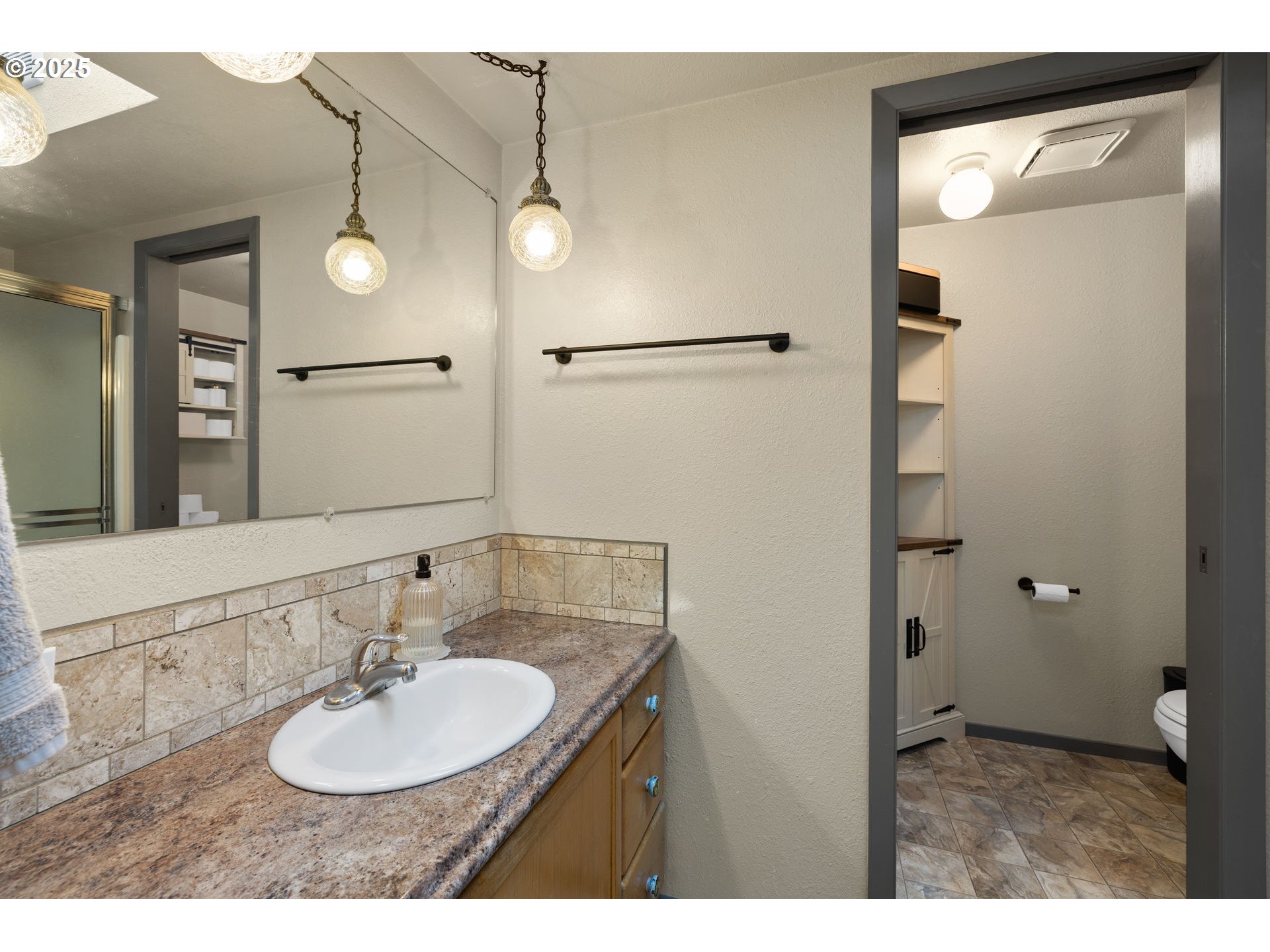 730 Southeast 2nd Avenue Camas, WA 98607 - Photo 8 of 22 a bathroom with a sink and a mirror