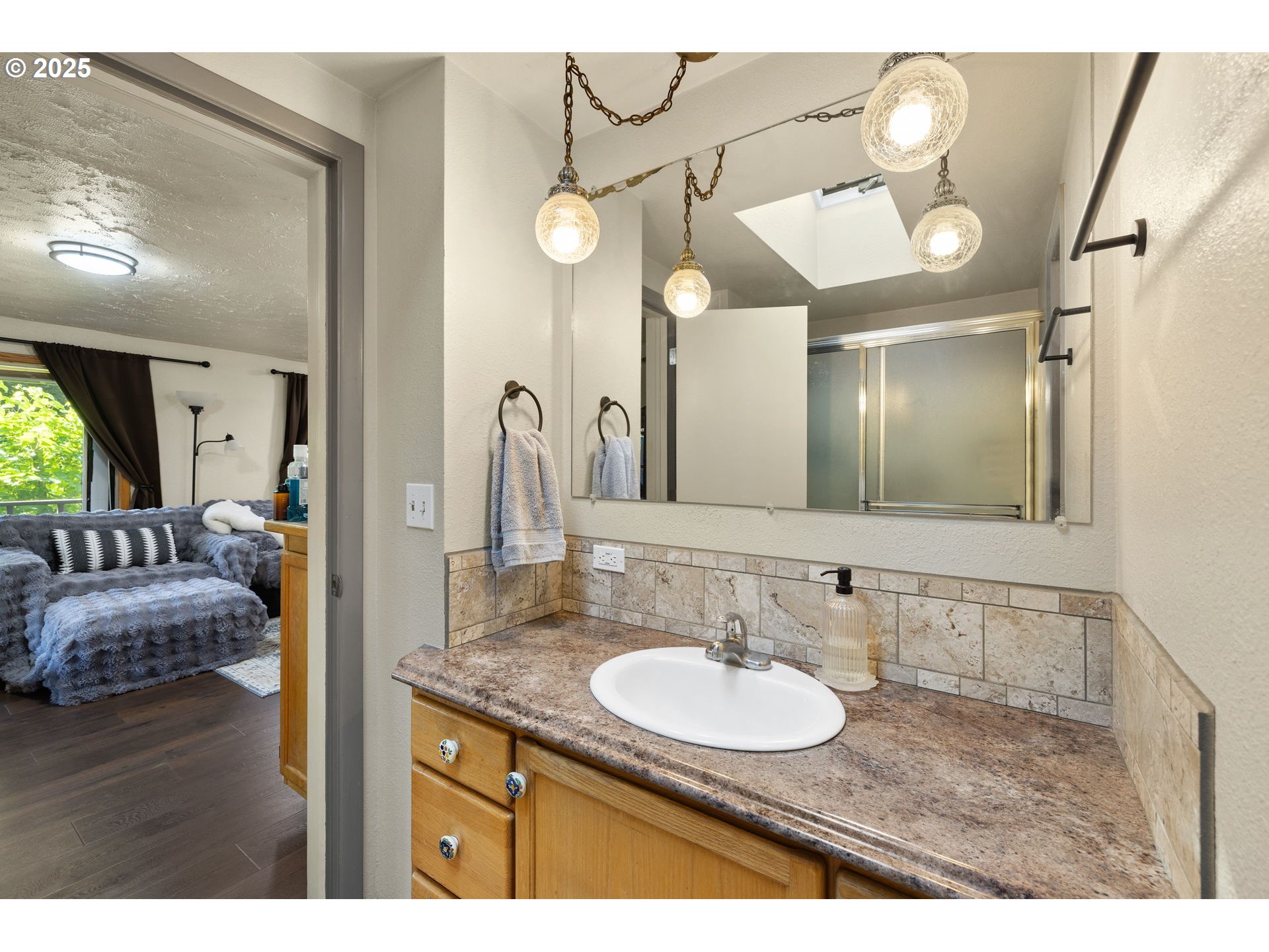 730 Southeast 2nd Avenue Camas, WA 98607 - Photo 9 of 22 a bathroom with a granite countertop sink and a mirror
