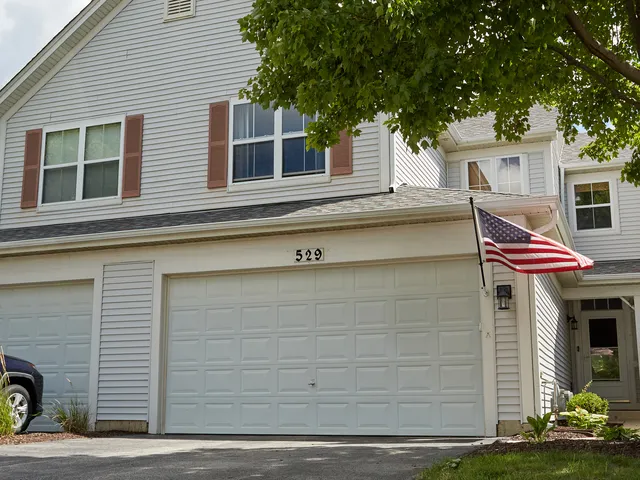 a view of a house with a garage