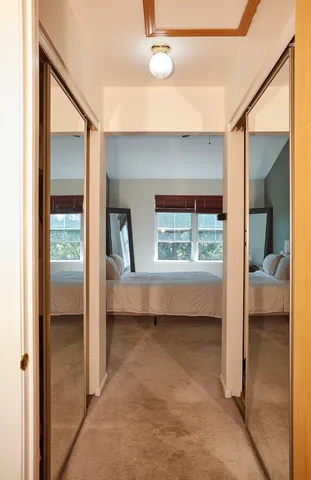 a view of bedroom from the hallway