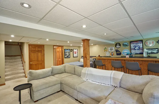 a view of a living room a couch and a potted plant