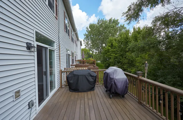 a view of balcony with deck and outdoor seating