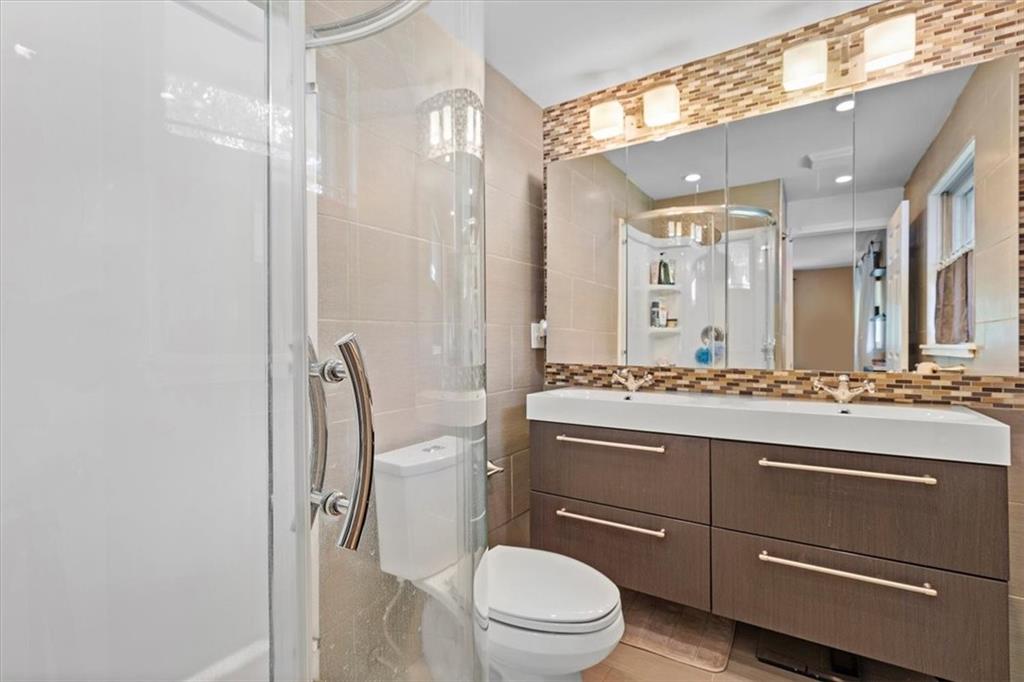 108 South Jamestown Road Coraopolis, PA 15108 - Photo 15 of 25 a bathroom with a toilet a sink and a mirror