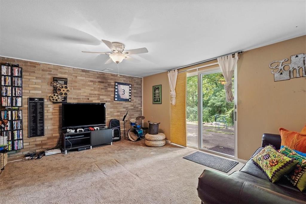 108 South Jamestown Road Coraopolis, PA 15108 - Photo 20 of 25 a living room with furniture a flat screen tv and a window