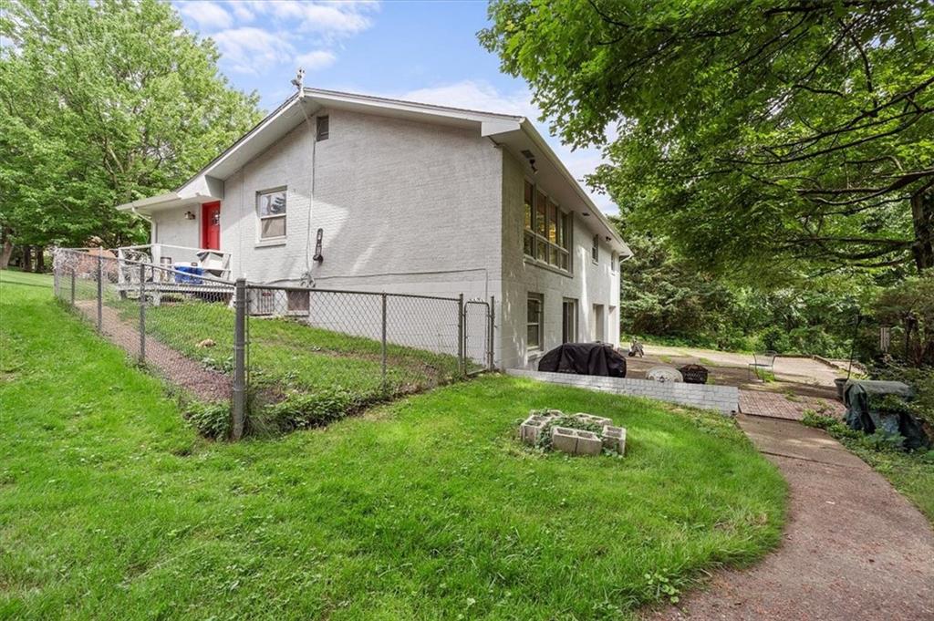 108 South Jamestown Road Coraopolis, PA 15108 - Photo 24 of 25 a view of a white house in front of a big yard plants and large trees