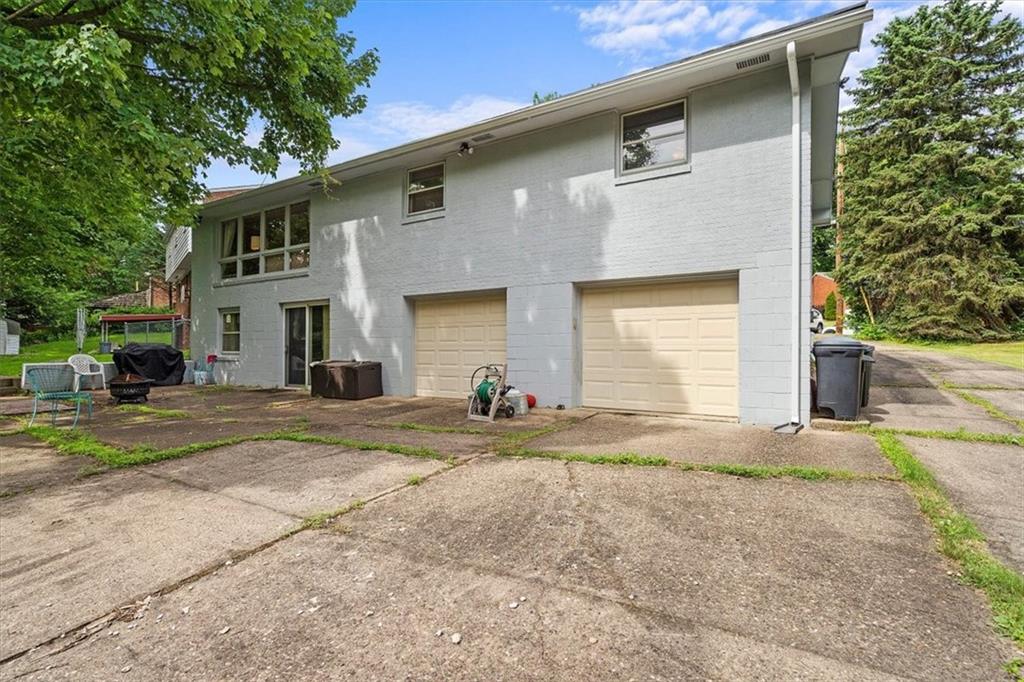 108 South Jamestown Road Coraopolis, PA 15108 - Photo 25 of 25 a front view of a house with a yard and garage