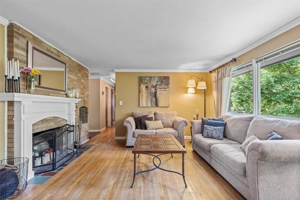 108 South Jamestown Road Coraopolis, PA 15108 - Photo 5 of 25 a living room with furniture and a fireplace
