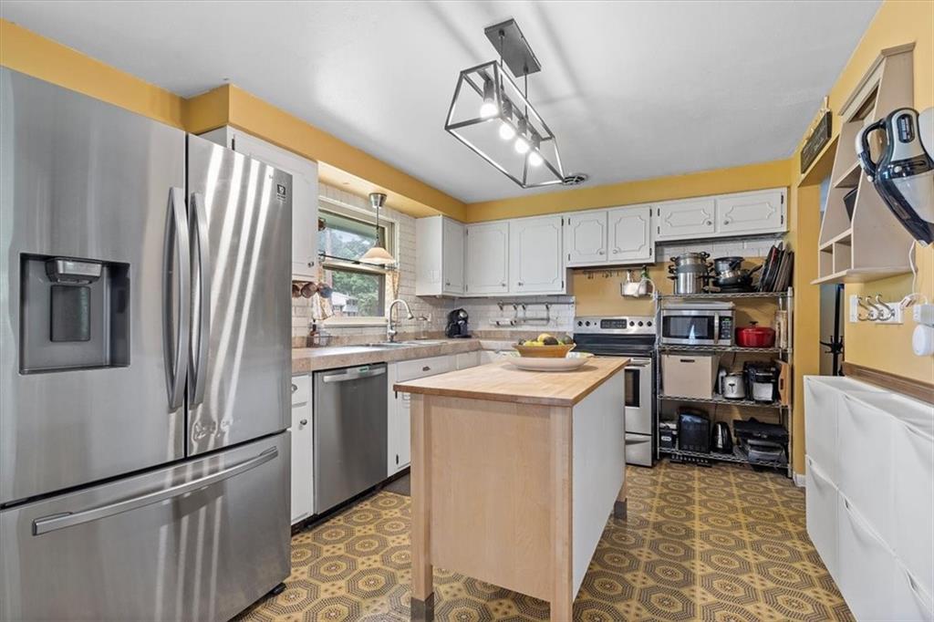 108 South Jamestown Road Coraopolis, PA 15108 - Photo 9 of 25 a kitchen with refrigerator cabinets and furniture
