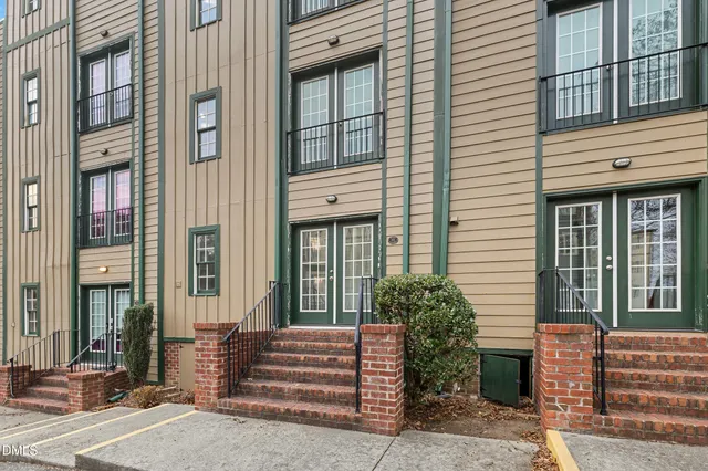 a view of a building with a window and stairs