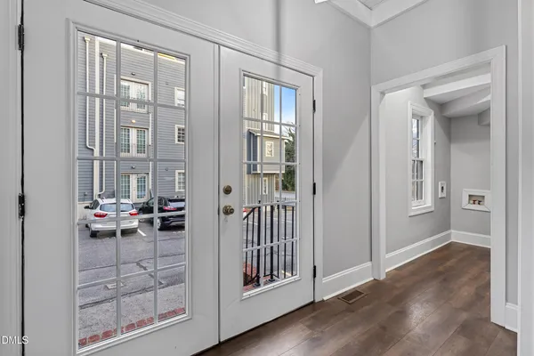 a view of a livingroom with furniture and hardwood floor