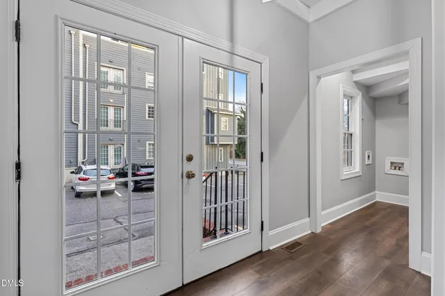 a view of a livingroom with furniture and hardwood floor