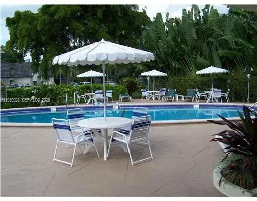 a patio with a patio table and chairs
