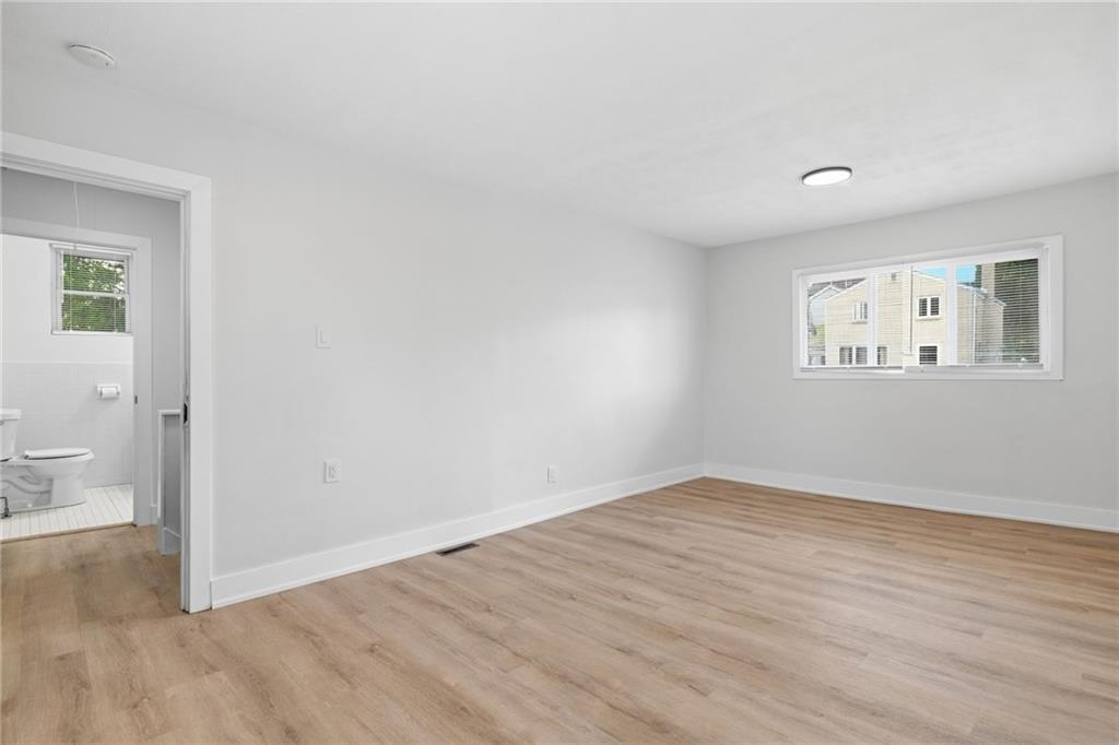 2961 Ruthwood Avenue Pittsburgh, PA 15227 - Photo 19 of 29 an empty room with wooden floor and a window