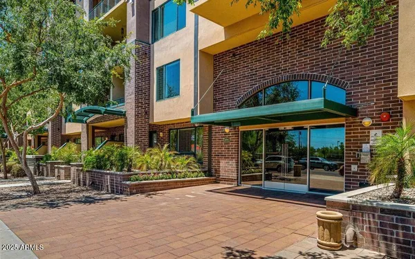 a front view of a building with garden